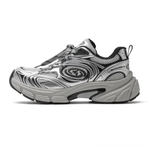 Front three-quarter view of silver white chunky sneakers with spiral side logo, dark grey trim, breathable mesh, and thick cream streetwear sole