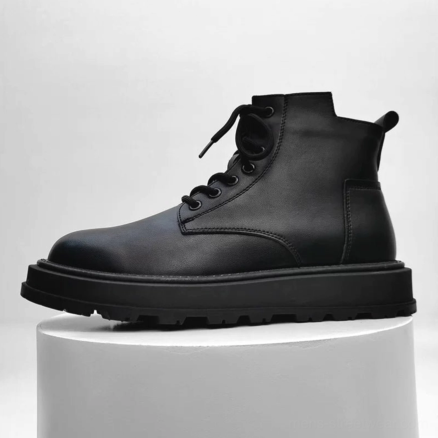 Single black mid-top platform combat boot displayed on a white stand with smooth upper, round toe, front laces and concealed side zipper