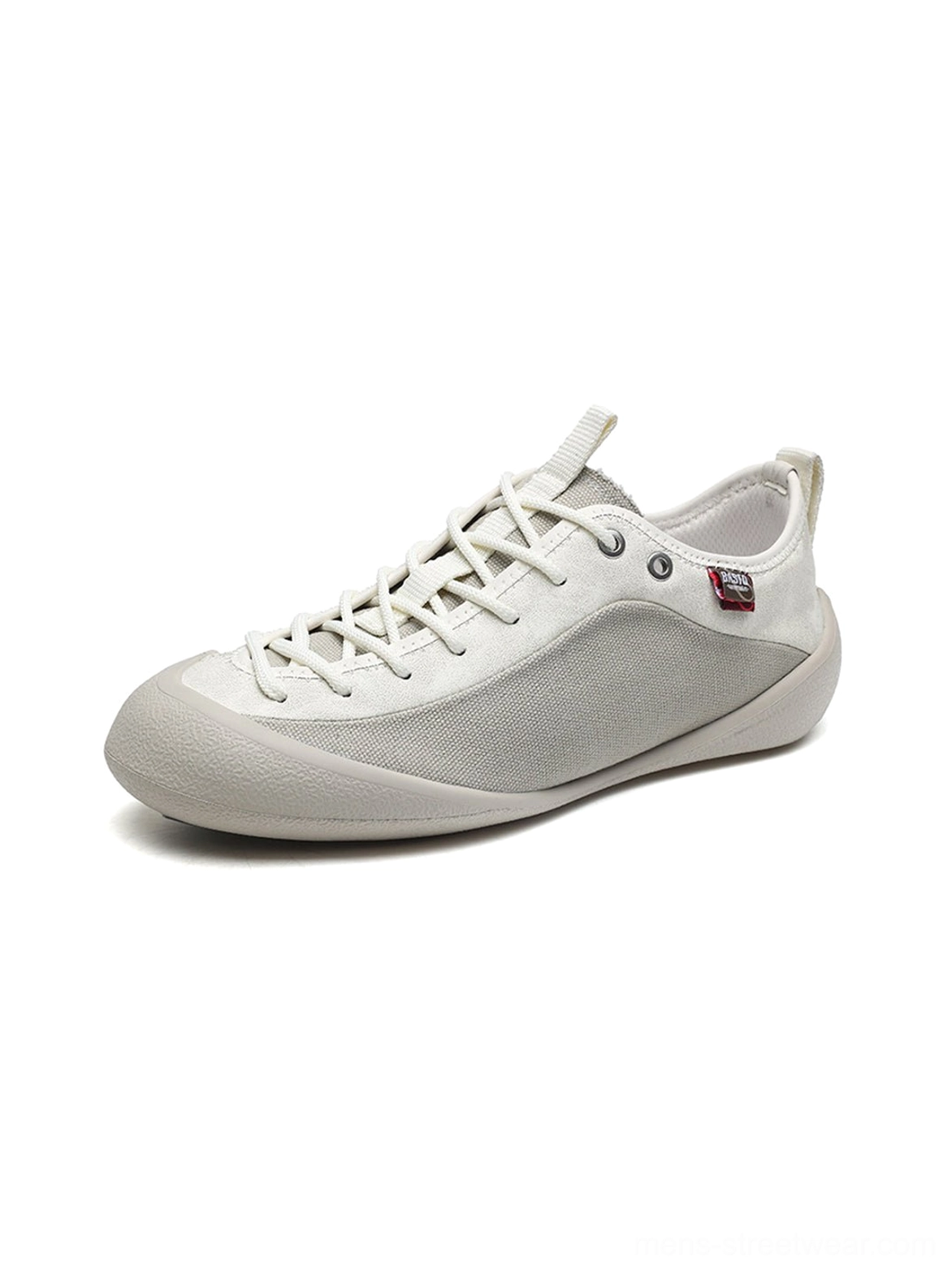 Single ivory mesh-panel sneaker shown from the right side with lace-up closure, smooth rubber outsole, and structured canvas upper