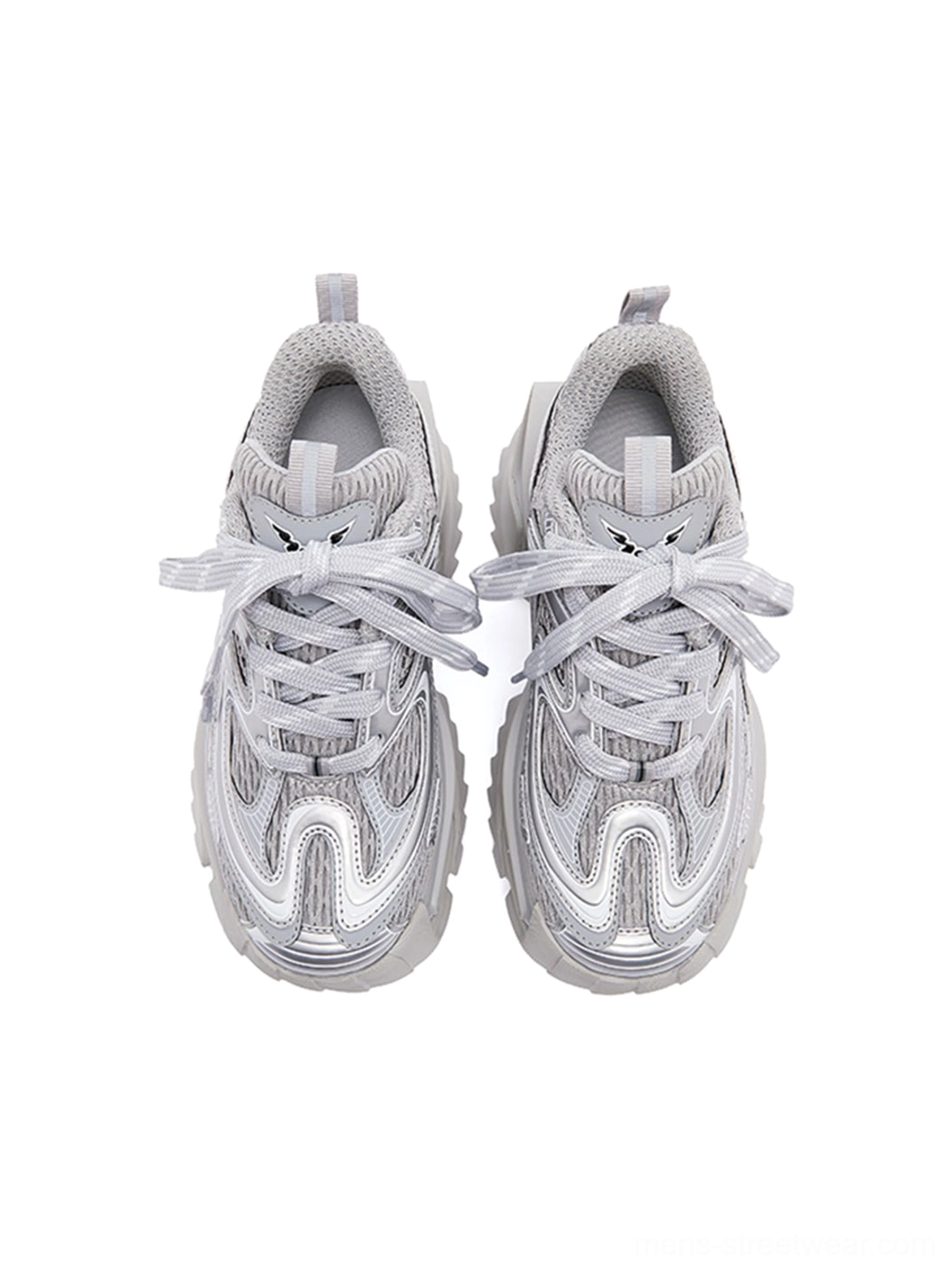 Single silver mesh sneaker viewed from above, showing the lace-up closure, layered overlays, hollowed chunky sole, and futuristic techwear profile