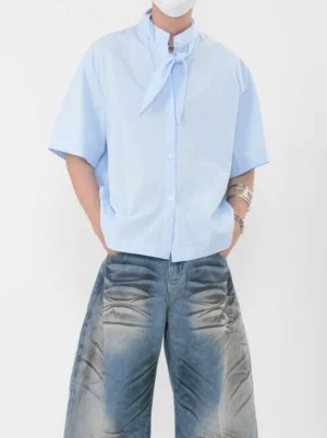 Sky blue knot collar shirt with attached scarf tie, relaxed drop shoulder sleeves, and loose Korean streetwear fit styled with washed wide-leg jeans