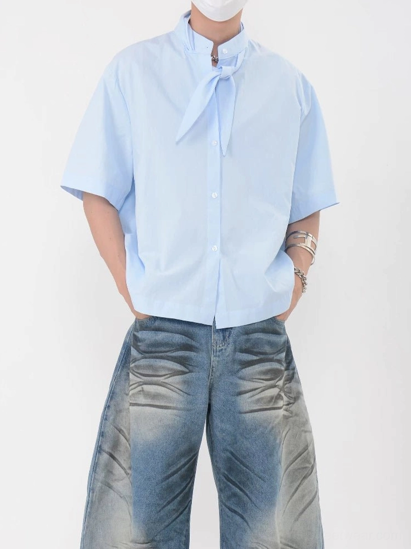 Sky blue knot collar shirt with attached scarf tie, relaxed drop shoulder sleeves, and loose Korean streetwear fit styled with washed wide-leg jeans