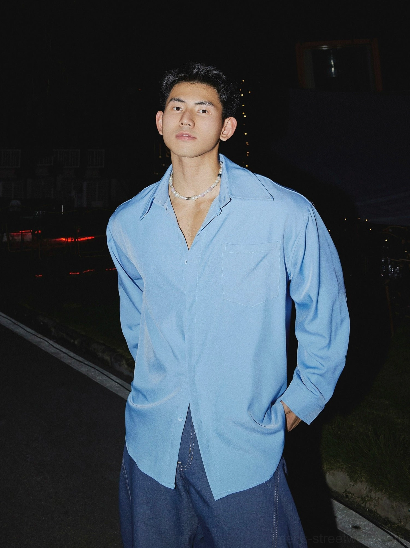 Sky blue oversized men's streetwear dress shirt in a clean Korean fashion inspired urban outfit