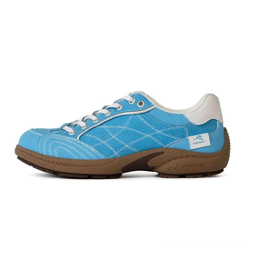 Sky blue retro runner sneakers with crisscross stitched canvas upper, white heel collar, rounded toe, and brown rubber outsole