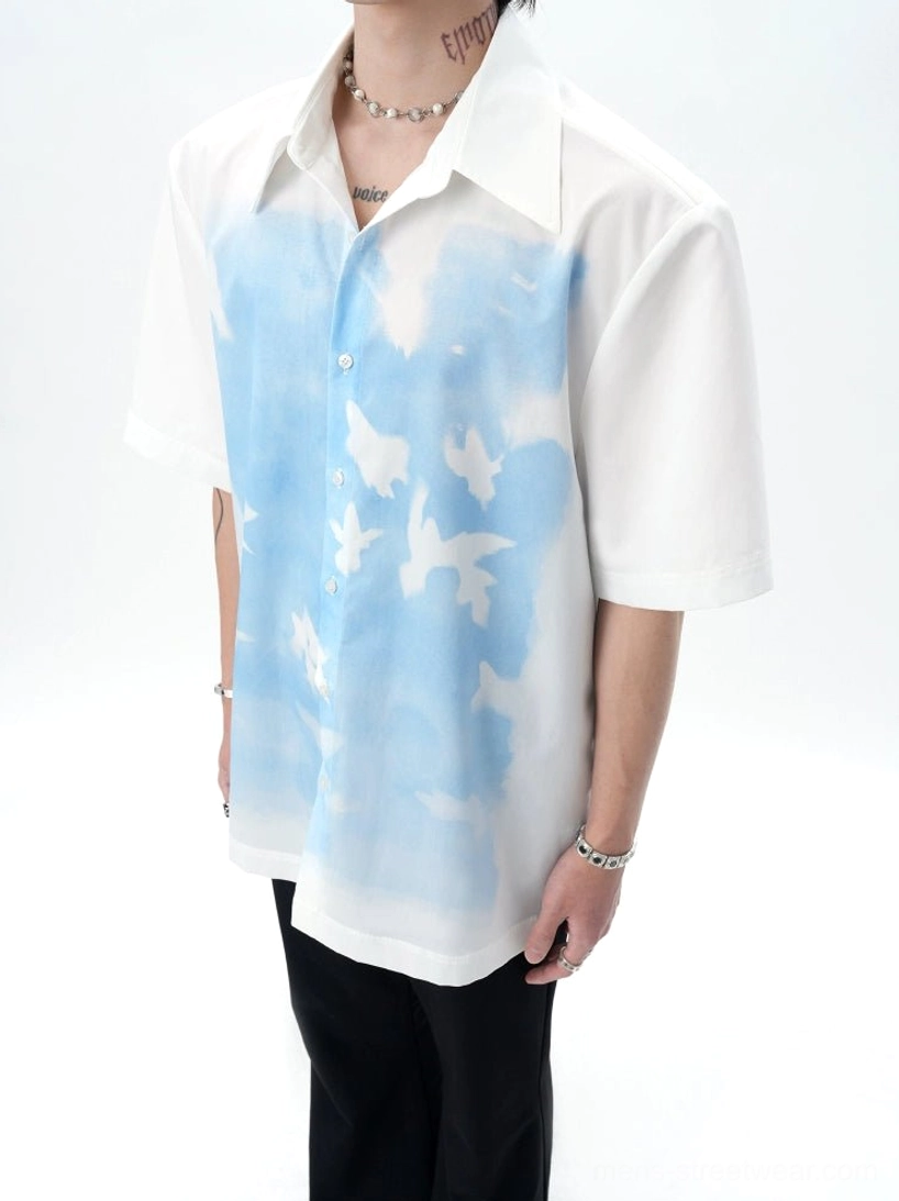 Close up of Skybound Doves Dream shirt classic collar button placket smooth fabric and white dove sky print