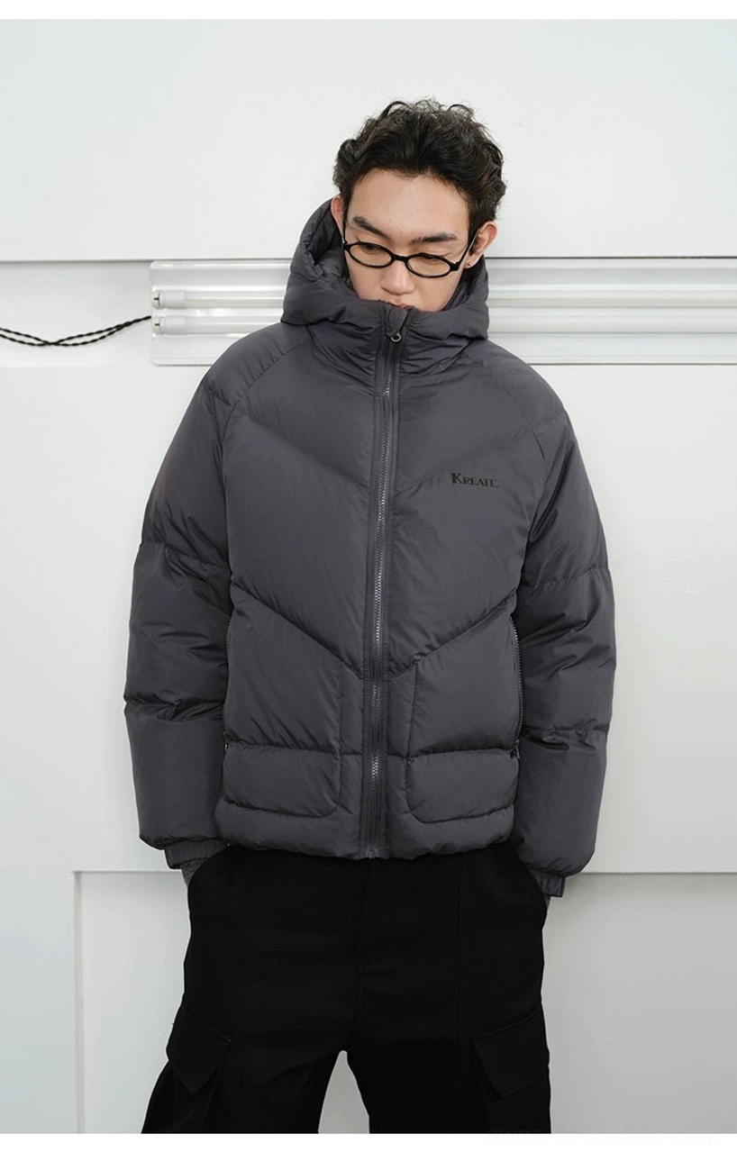 Slate grey hooded down puffer jacket with hood raised showing warm relaxed oversized Korean streetwear fit
