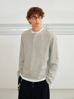 Men's slim layered long-sleeve Henley shirt in heather Floral Gray styled with black wide-leg streetwear pants and white layered neckline trim