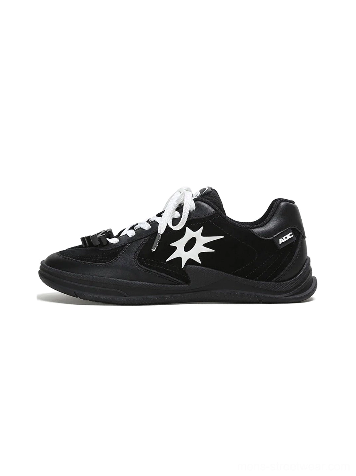 Black solar star applique leather court sneaker with white laces and decorative lace charms shown from the left side
