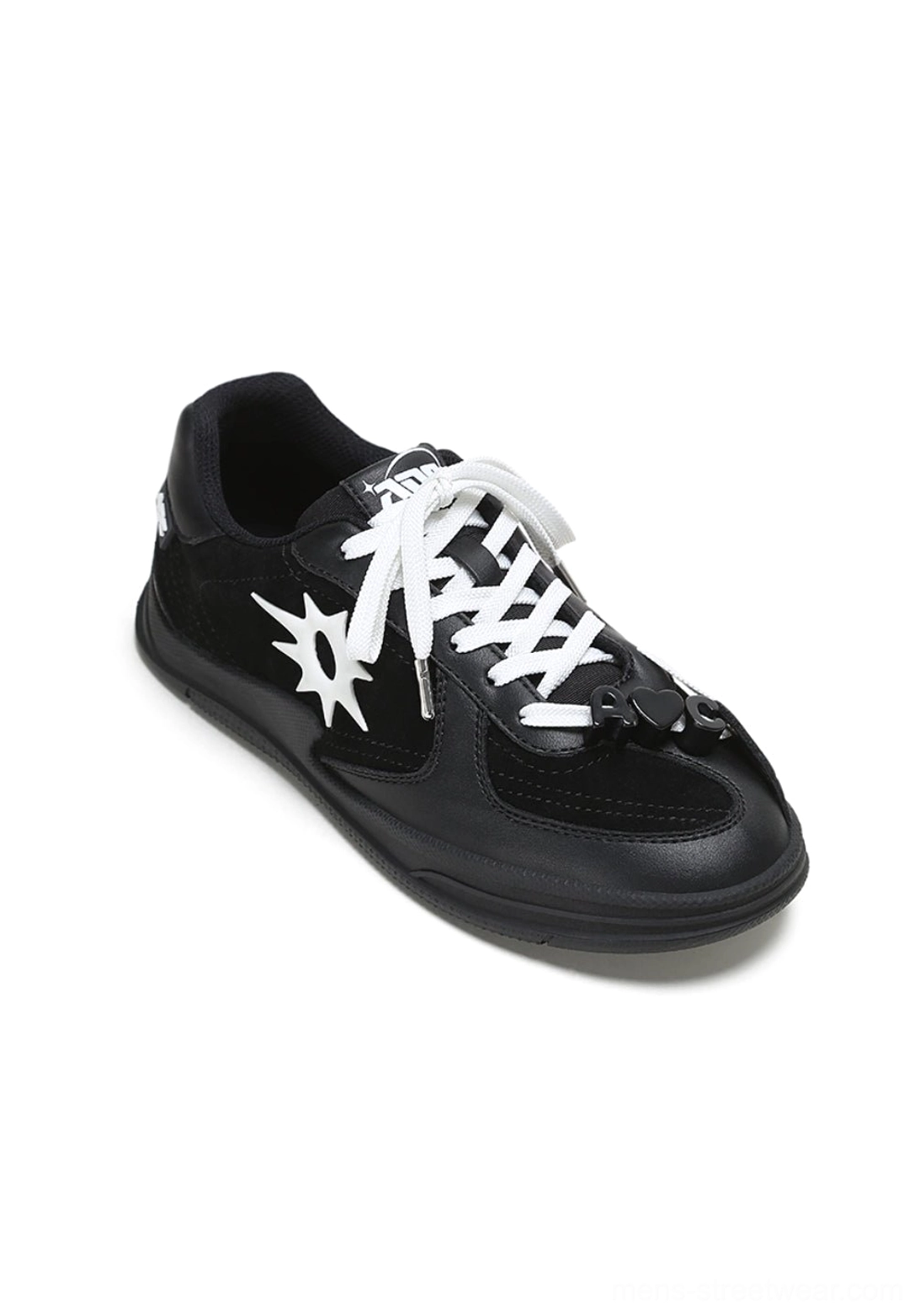 Right side view of a black leather solar star applique court sneaker with white laces and smooth upper