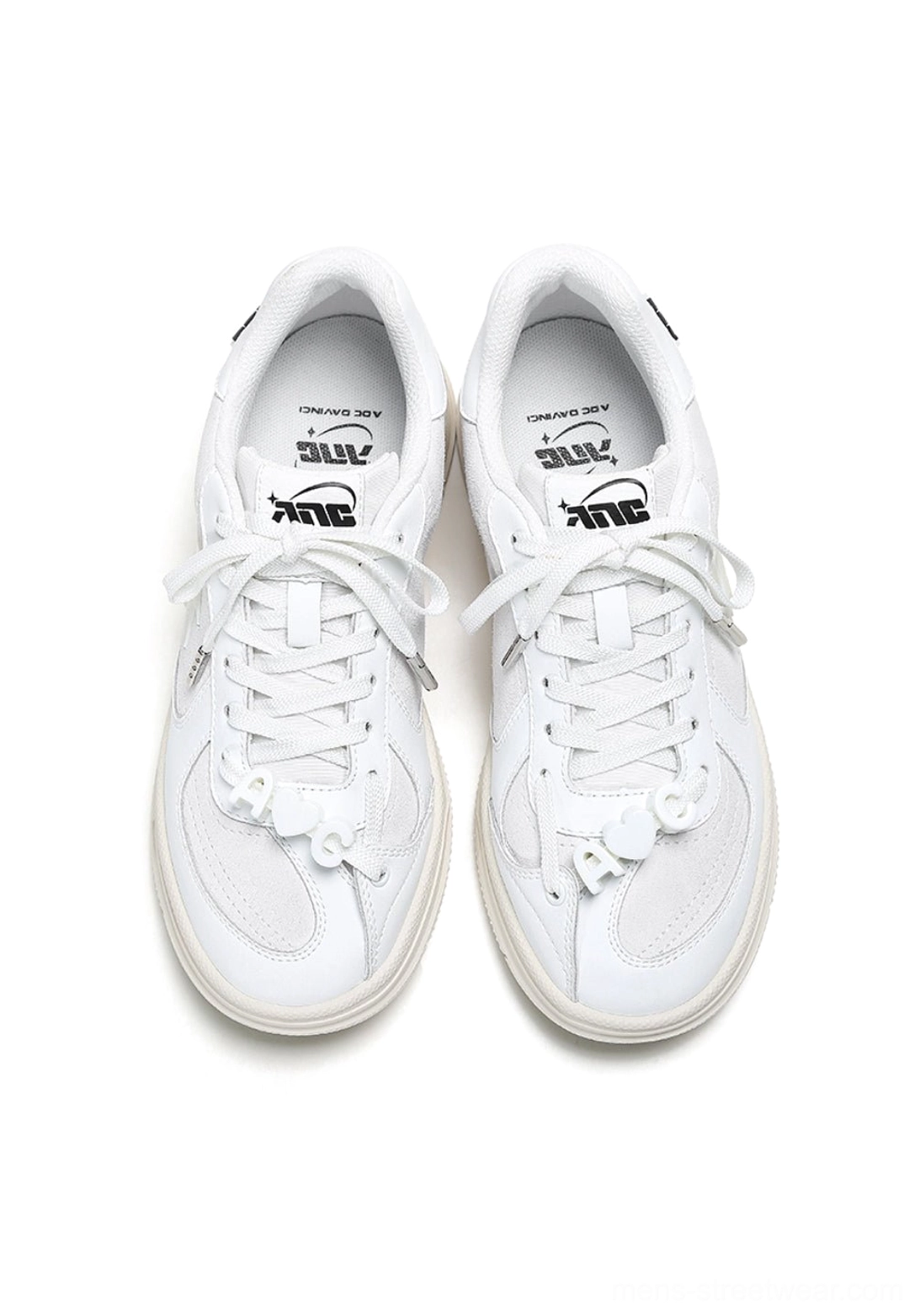 Black leather solar star applique sneakers with contrasting white laces and slim court outsole