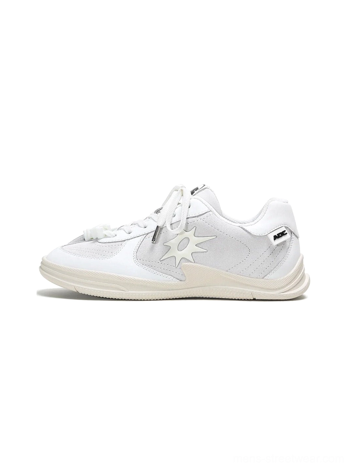 Black and white solar star applique leather court sneakers product detail view for streetwear styling