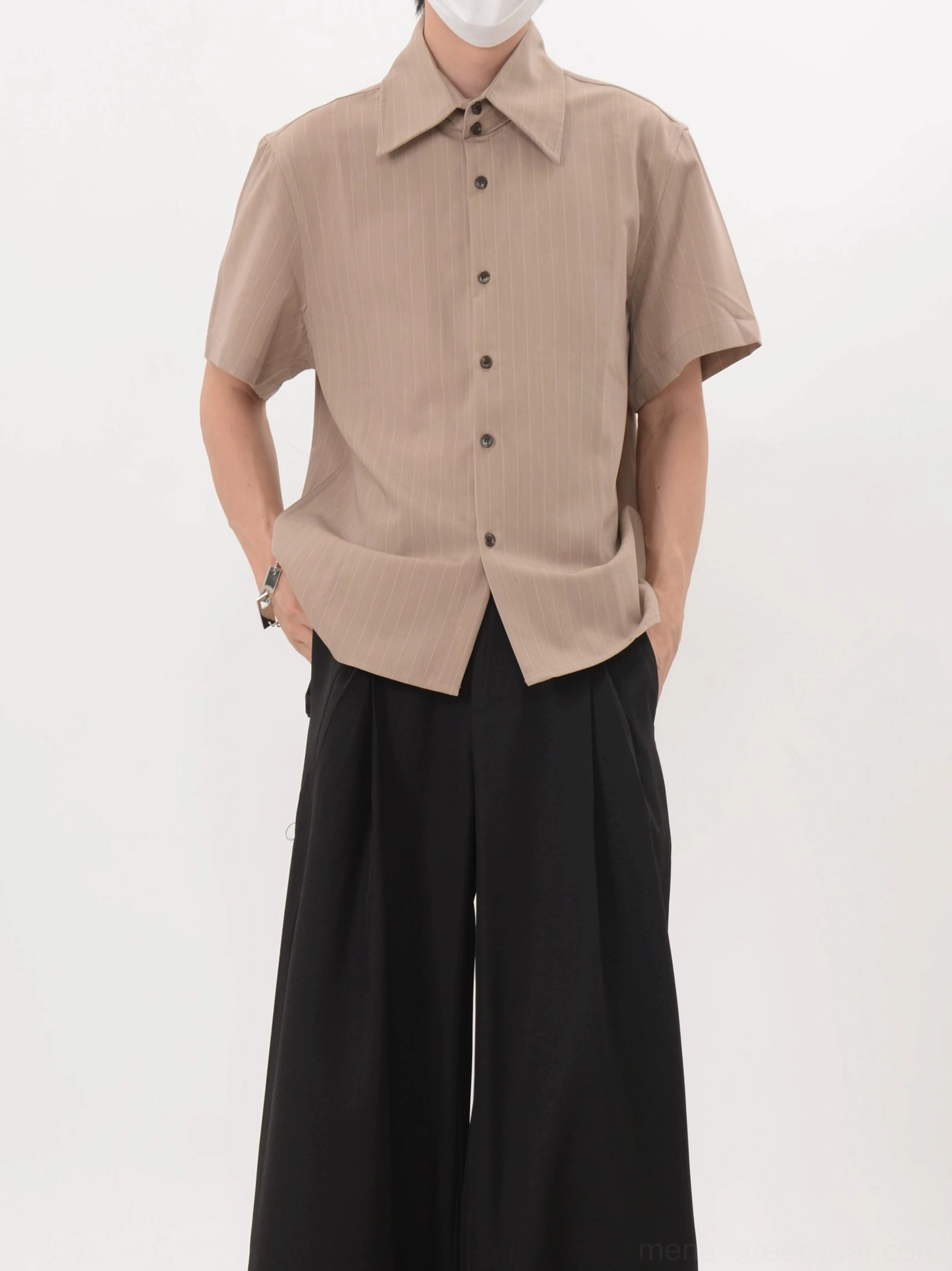 Solid khaki short sleeve spread collar shirt with dark buttons and relaxed Acubi streetwear styling
