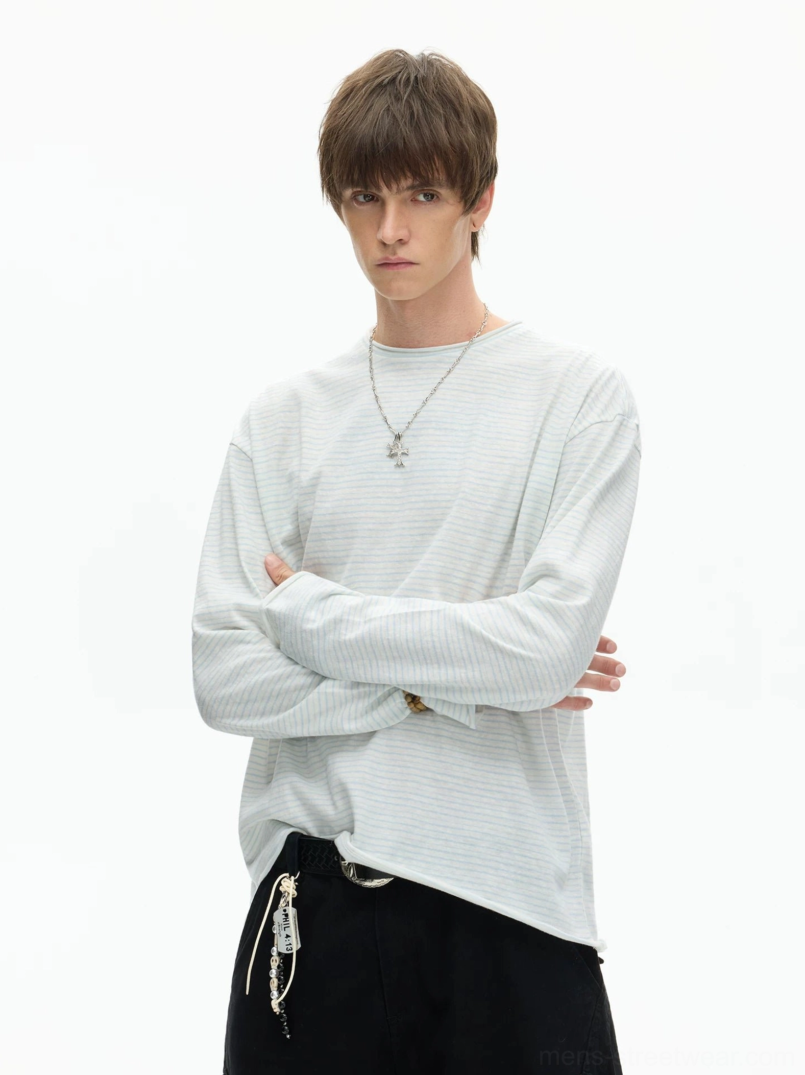 Solid light grey relaxed fit long sleeve crew neck tee styled with black pants and contemporary East Asian streetwear accessories