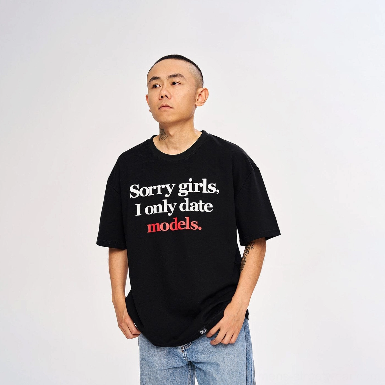 Black oversized graphic slogan T-shirt with white and red typography Korean streetwear outfit