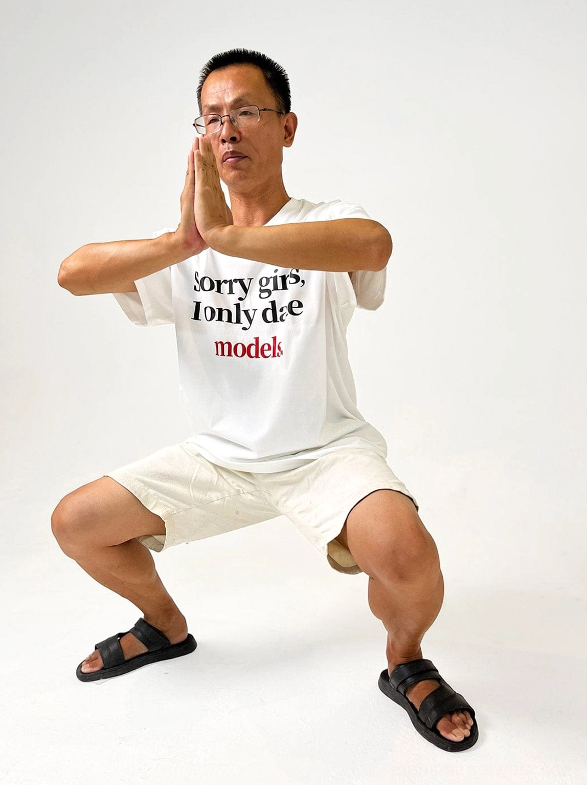White oversized graphic slogan T-shirt casual full body outfit with shorts and slides