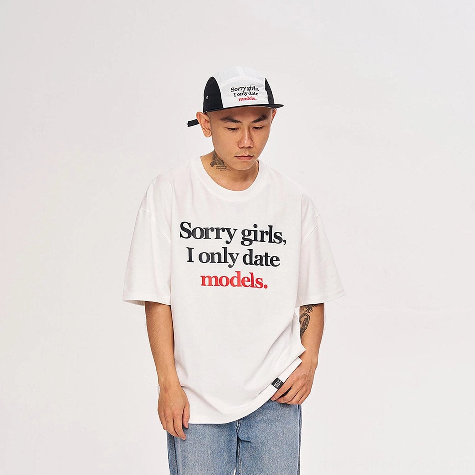 Full body view of white oversized Sorry Girls I Only Date Models graphic T-shirt with casual streetwear styling