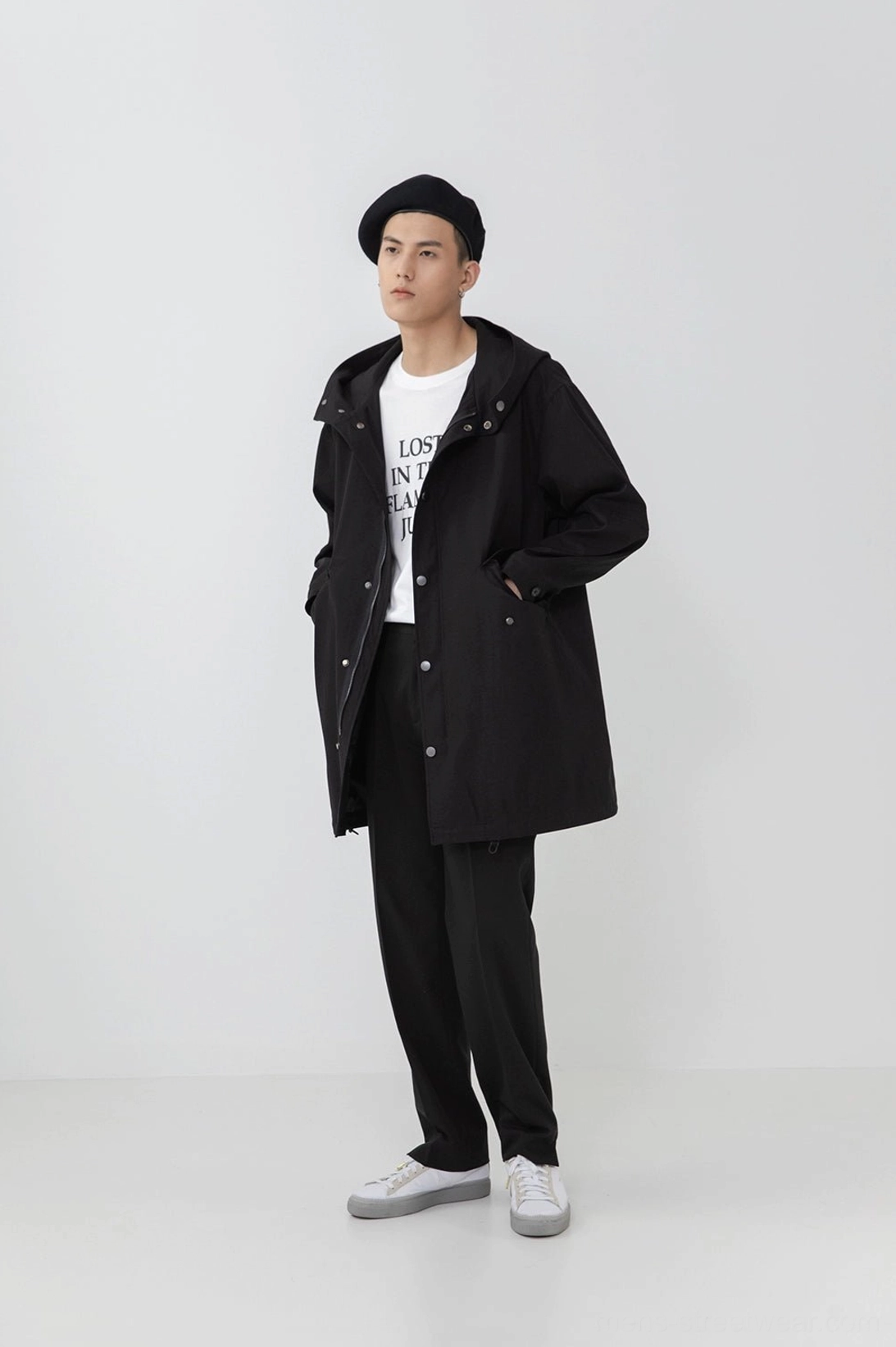 Split hem pants styled with minimal accessories contemporary urban aesthetic