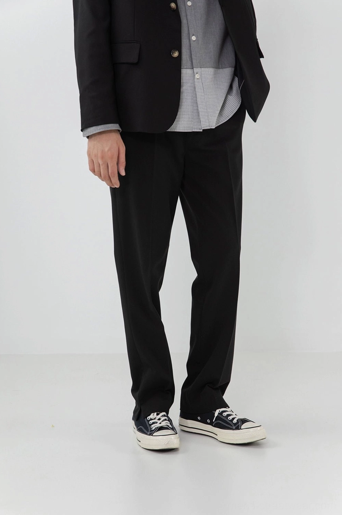 Split hem pants tailored silhouette precision construction craftsmanship detail