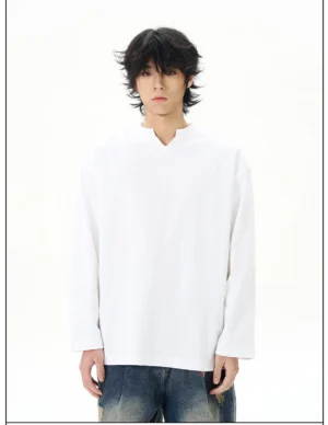 White split-neck cotton long-sleeve streetwear shirt shown in a full front view with a relaxed fit and distressed denim jeans