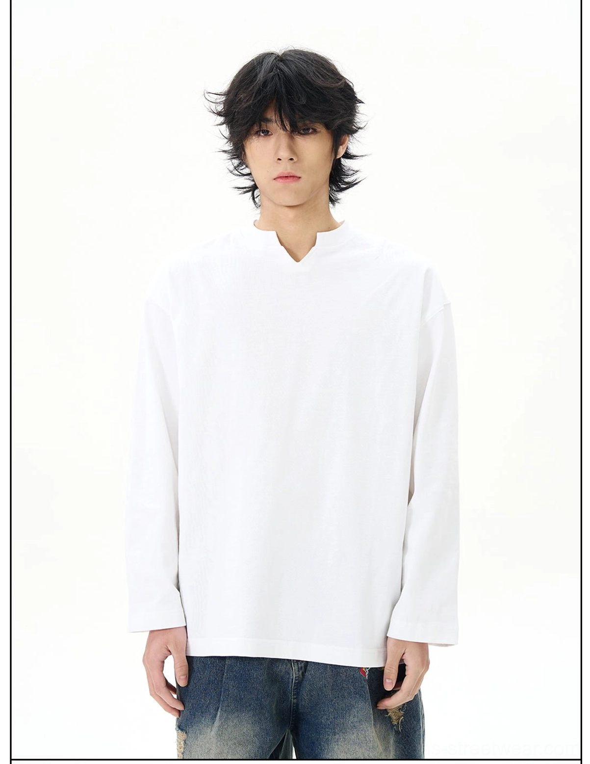 White split-neck cotton long-sleeve streetwear shirt shown in a full front view with a relaxed fit and distressed denim jeans