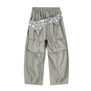 Dark taupe gray star overlay layered cargo pants with silver star waist sash, elastic waistband, draped panels, and long drawstrings