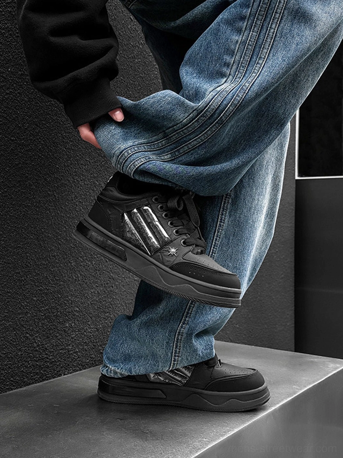 Star studded gothic sneakers in black with silver side panels and chunky platform soles for alternative streetwear styling