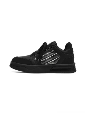 Star studded gothic black sneakers with silver side panels and chunky platform rubber soles shown in side profile