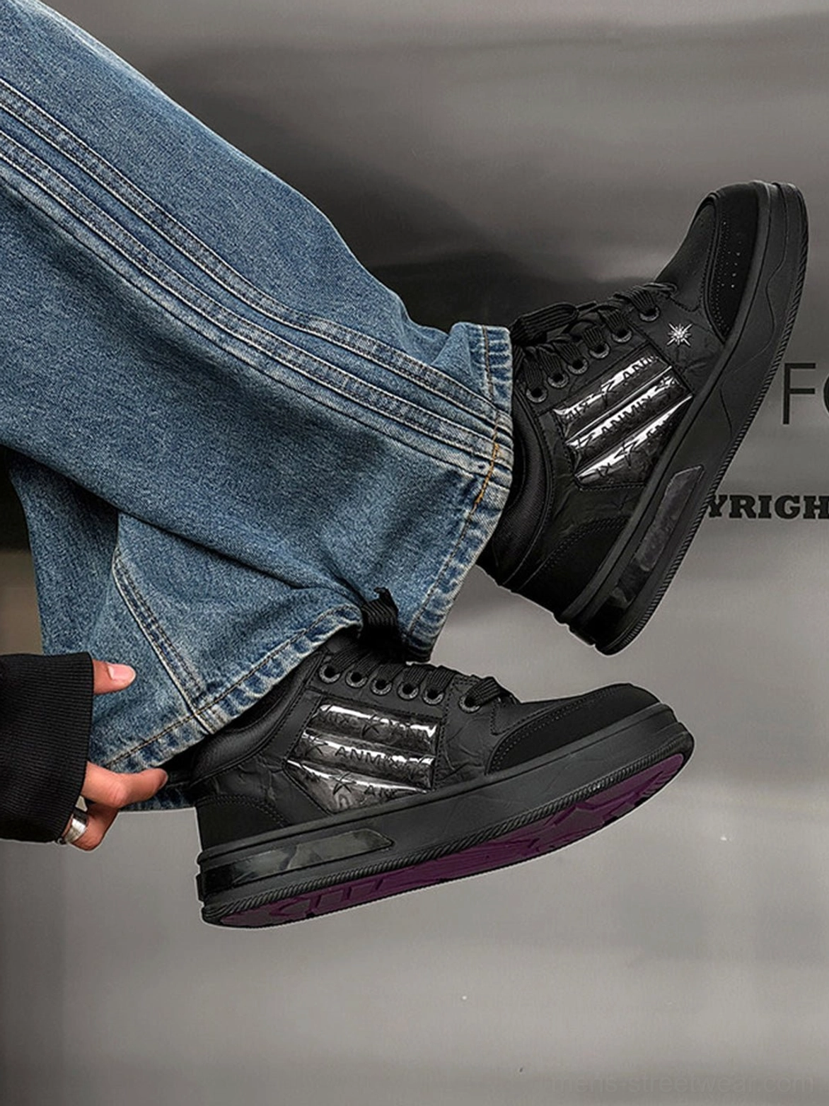 Star studded gothic skate sneakers with silver striped panels, purple rubber outsole, and chunky platform construction