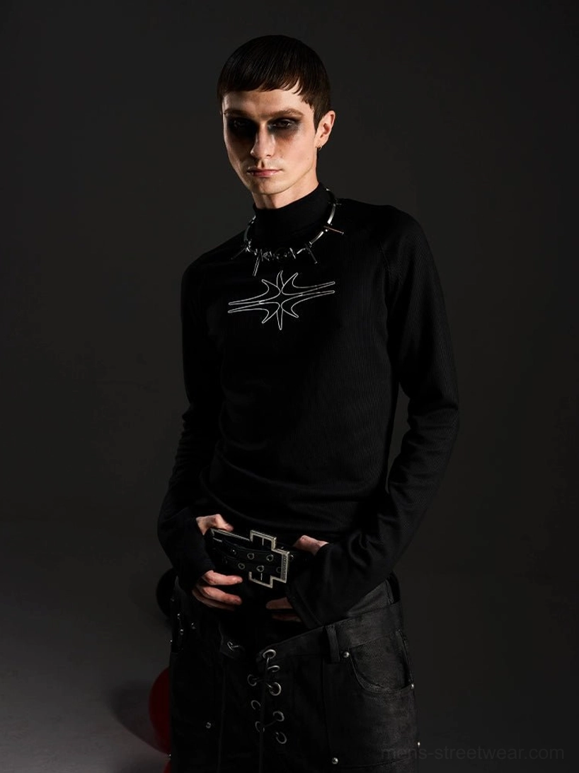 Front view of a fitted black gothic mockneck top with ribbed texture, elongated sleeves, and abstract white star chest graphic