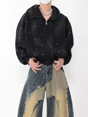 Black rhinestone studded oversized zip-up hoodie worn with patchwork wide-leg jeans in a full front streetwear outfit view