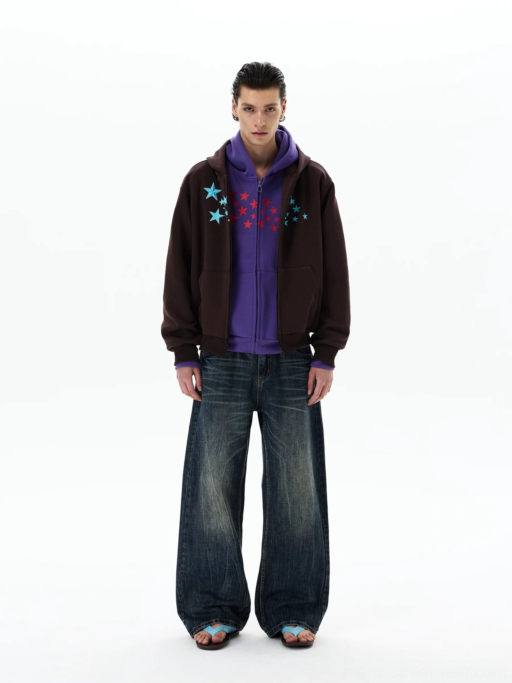 Brown Stellar Drift oversized star print zip-up hoodie styled with dark wide-leg jeans, full-body front view
