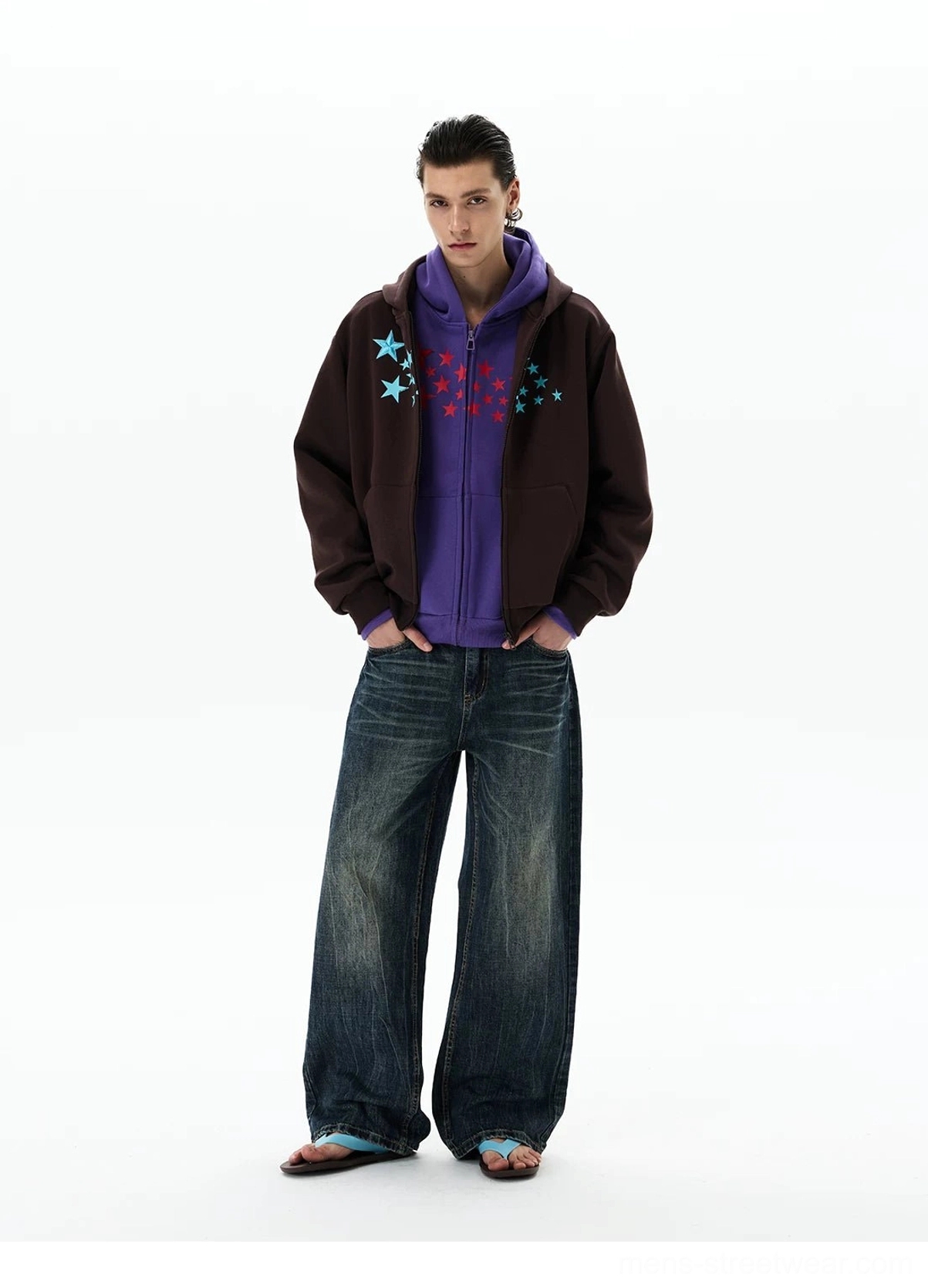 Brown Stellar Drift oversized star print zip-up hoodie layered with dark wide-leg jeans in a full-body streetwear outfit
