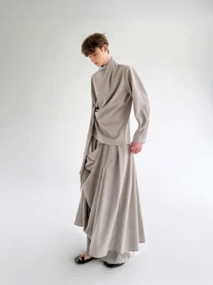 Stone gray draped layered wide leg pants styled in a deconstructed mens streetwear outfit side view