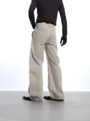 Light apricot Stormchain wide-leg cotton trousers rear view showing relaxed fit and back patch pockets