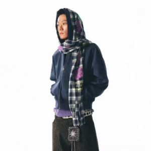 Side view of oversized navy zip-up hoodie with purple plaid strawberry print scarf worn over the hood