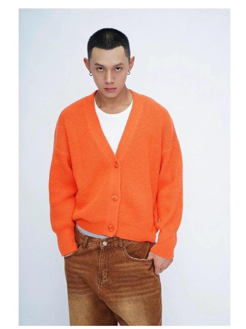 Streetwear fuzzy knit cardigan with relaxed oversized silhouette, playful back decorations, and versatile layering design