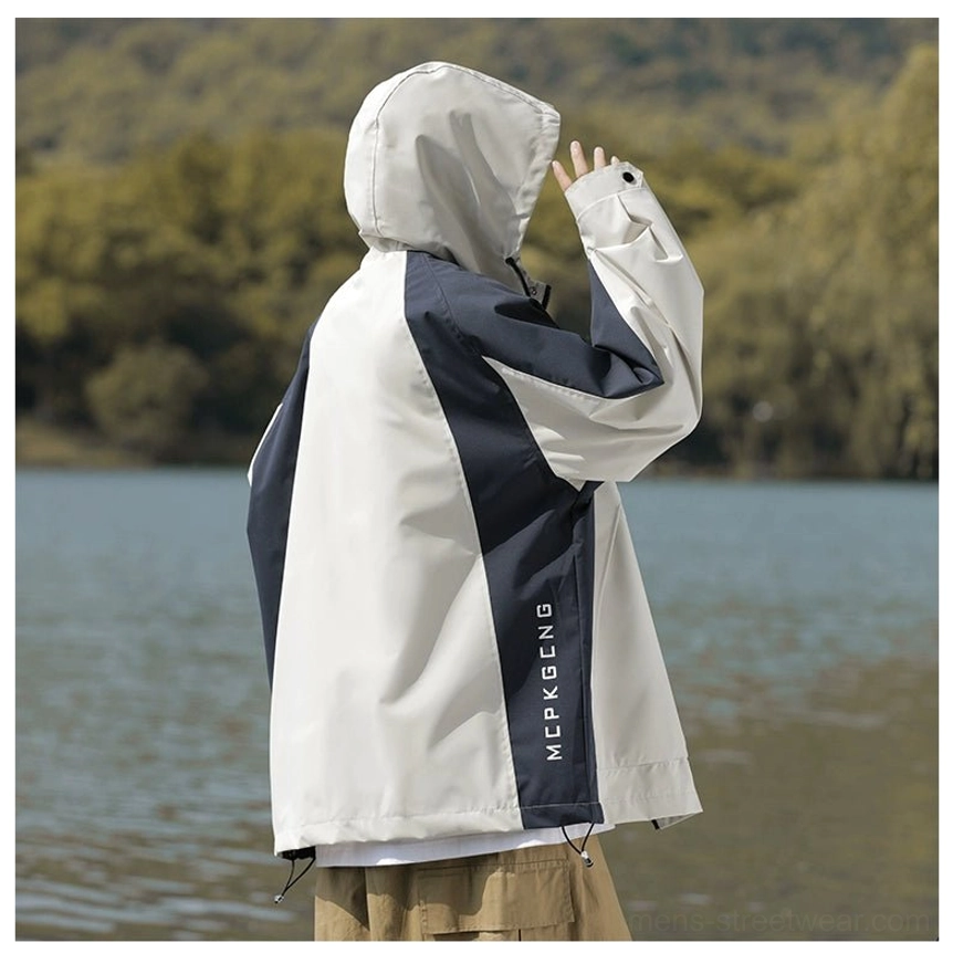 Streetwear hooded windbreaker jacket featuring contrasting color panels and practical utility pockets