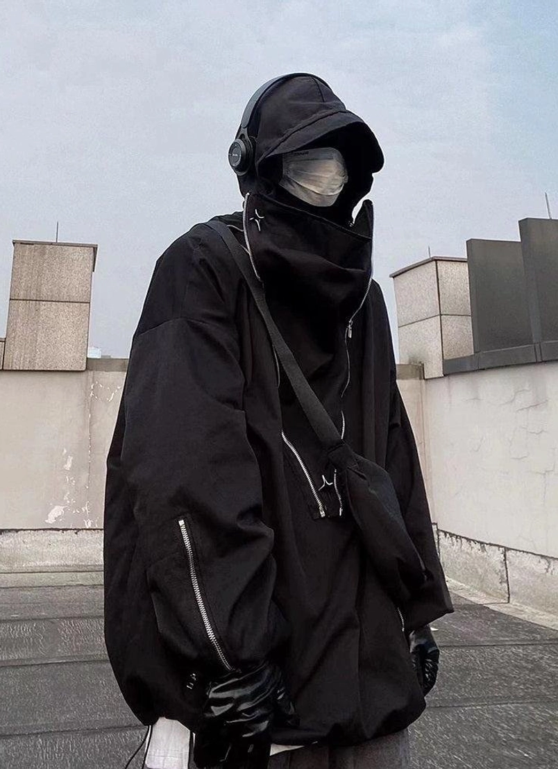 Streetwear tactical pullover jacket featuring an attached hood, high neckline, functional pockets, and modern utility styling
