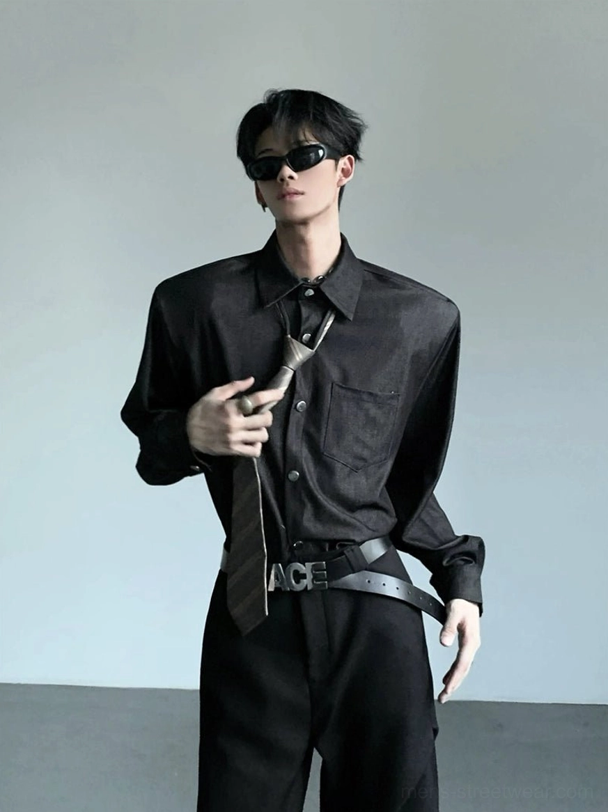 Men's structured wide shoulder black button-up shirt styled with a dark necktie for modern Korean streetwear formal outfit