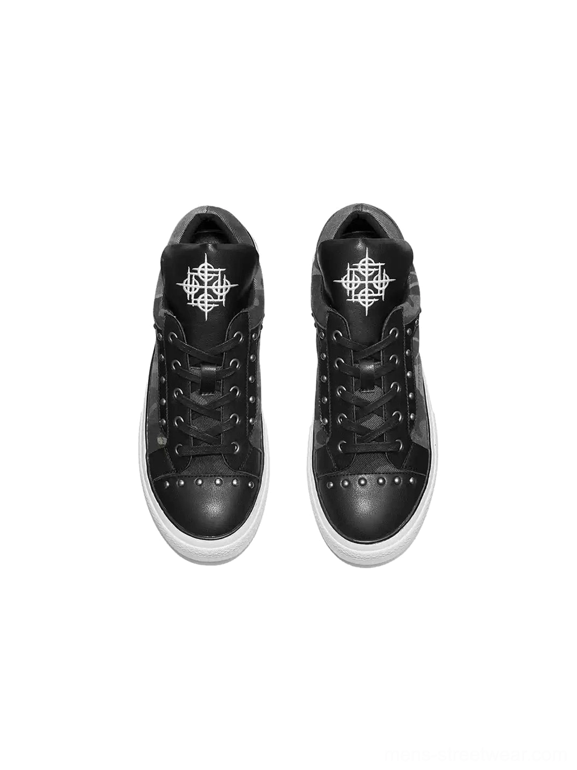 Top view of studded camo panel low top sneakers showing black lace-up closure riveted toe panels and padded tongue