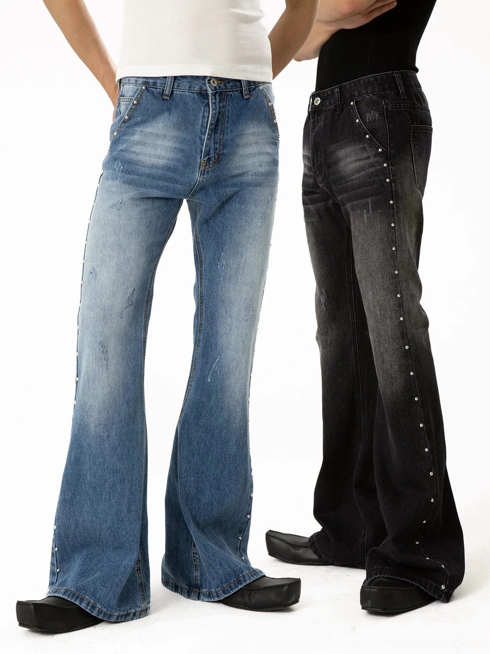 Front dual-model view of blue and black studded flare jeans with side rivet trim, high-rise bell-bottom silhouette, and Korean punk streetwear styling