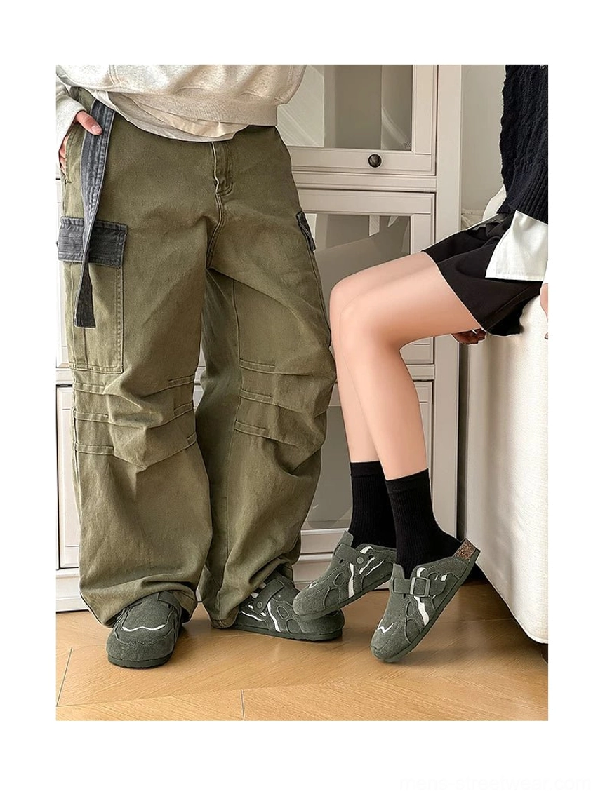 Side profile of suede buckle clogs in two color options worn for a coordinated casual couple streetwear look