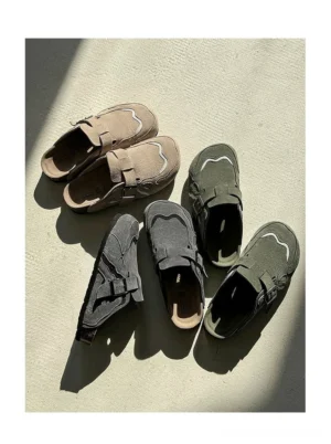 Top-down view of suede buckle cork footbed clogs in multiple neutral color options with layered upper panels and adjustable straps