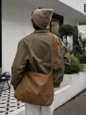 Suede-feel drape hobo tote worn from the back with relaxed Seoul streetwear outfit