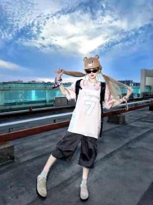Model wearing khaki sun buckle suede slide clogs with striped socks in a rooftop streetwear outfit