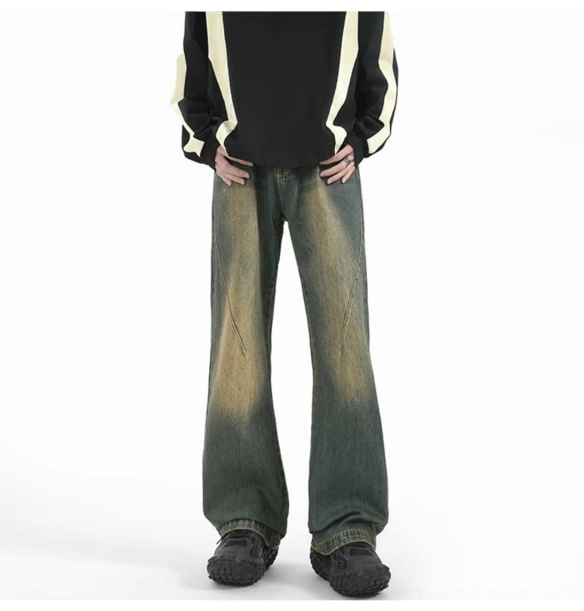 Front view of sun-washed vintage denim flare jeans featuring diagonal tailored seams and a clean wide-leg cut