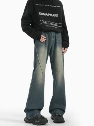 Front view of Retro Blue Sunfade Arc Flare Jeans with diagonal panel seams and relaxed wide-leg streetwear fit