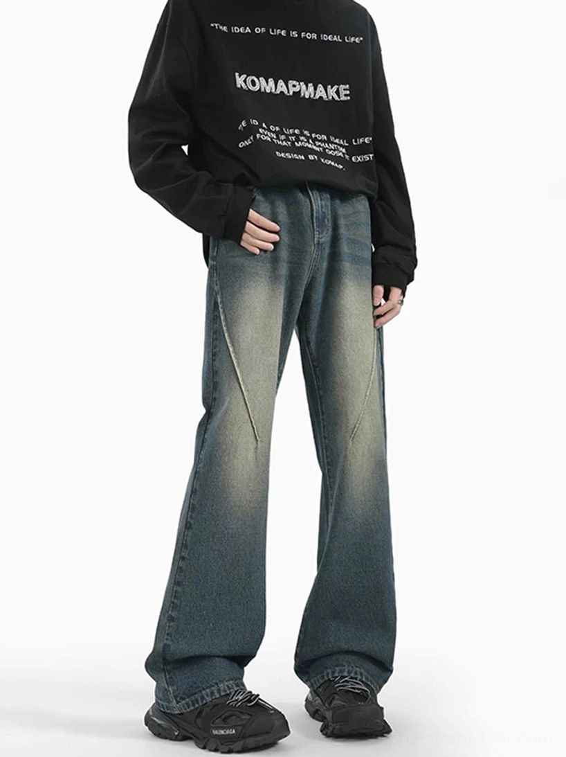 Front view of Retro Blue Sunfade Arc Flare Jeans with diagonal panel seams and relaxed wide-leg streetwear fit