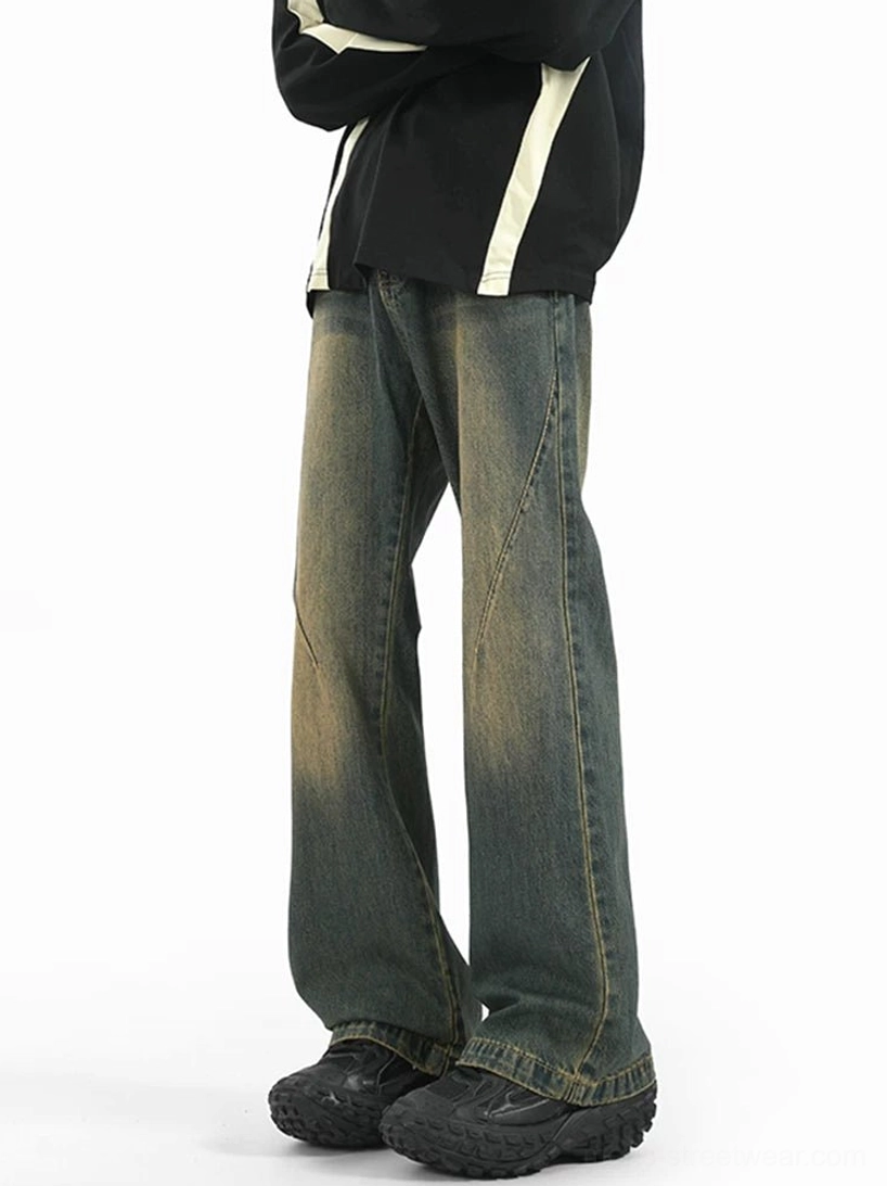 Side view of Sunfade Arc Flare Jeans in vintage washed denim styled with a black sweatshirt and chunky sneakers