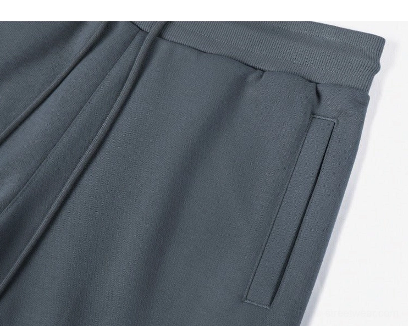 Hem finish detail drawstring sweat shorts raw cut edge contemporary streetwear aesthetic unfinished trim design element